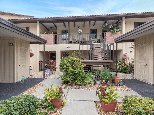 doorway to property featuring a balcony