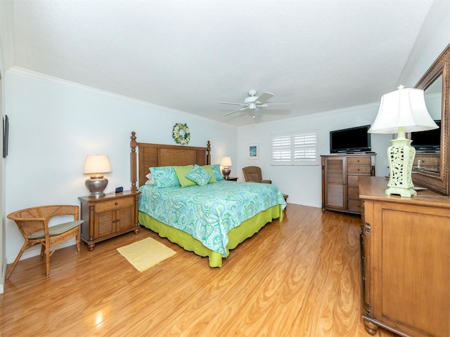 bedroom featuring crown molding and light hardwood / wood-style flooring