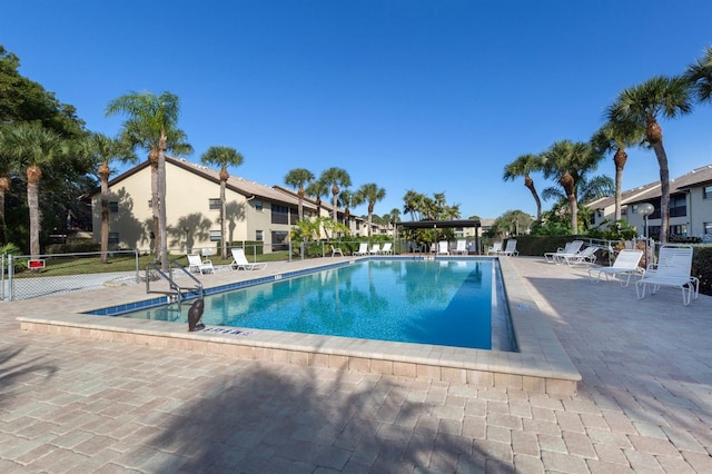 view of swimming pool with a patio