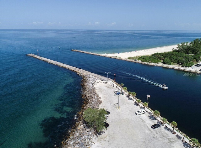 birds eye view of property with a view of the beach and a water view