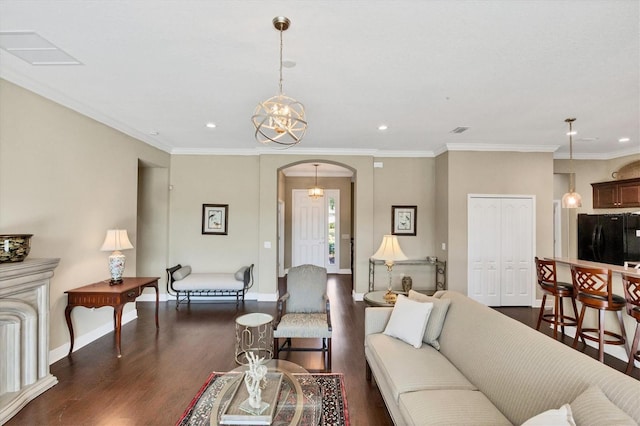 living room featuring ornamental molding and dark hardwood / wood-style floors