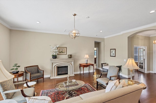 living room featuring dark wood-type flooring and ornamental molding