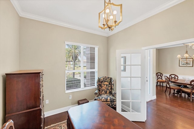 sitting room with crown molding, dark wood-type flooring, and a chandelier