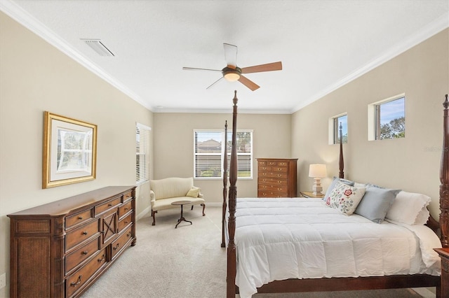 bedroom featuring ornamental molding, light colored carpet, and ceiling fan