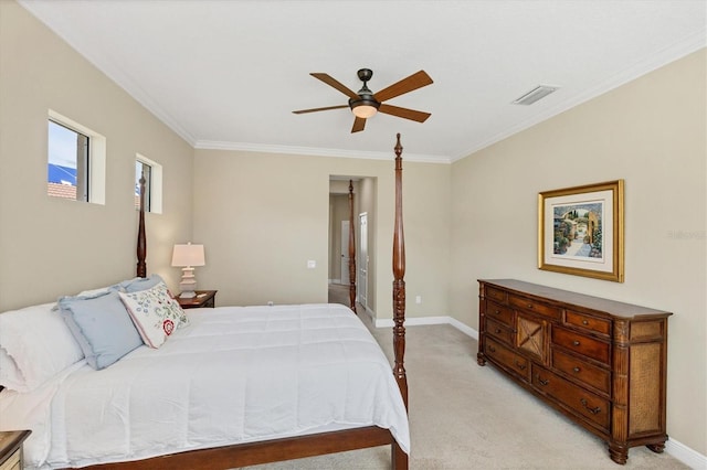 carpeted bedroom featuring crown molding and ceiling fan