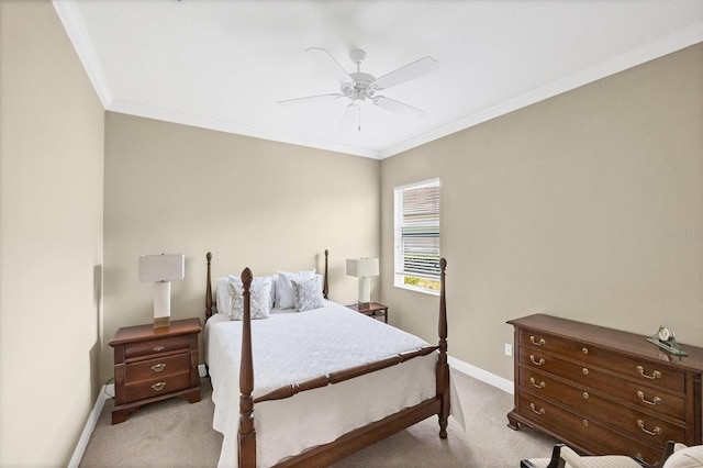 bedroom featuring crown molding, light carpet, and ceiling fan