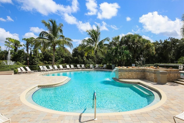 view of swimming pool with a patio area