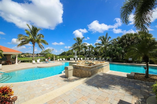 view of swimming pool with a patio