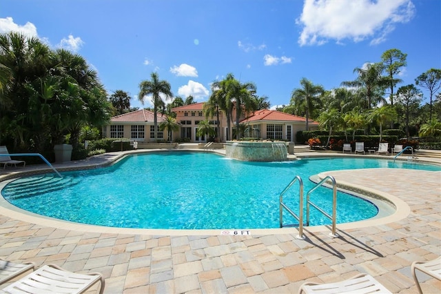 view of pool featuring a patio area and pool water feature