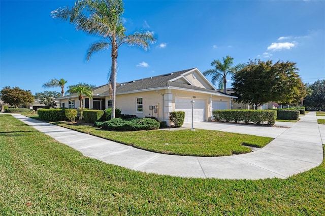 view of side of home with a garage and a lawn