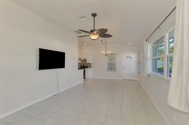 unfurnished living room featuring light tile patterned floors, ceiling fan with notable chandelier, and vaulted ceiling