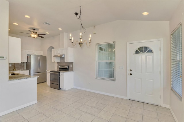 kitchen with white cabinetry, pendant lighting, ceiling fan, stainless steel appliances, and backsplash