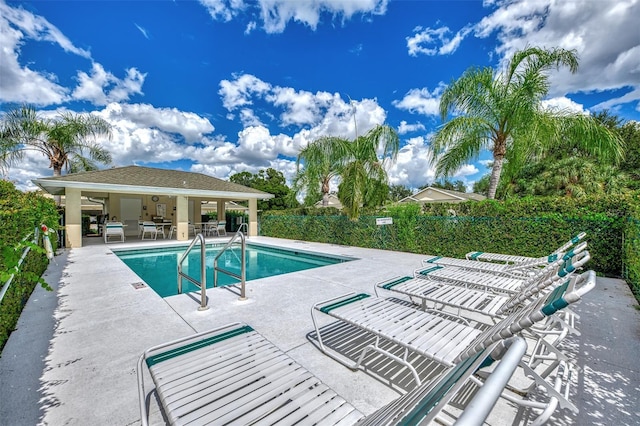 view of swimming pool featuring a patio