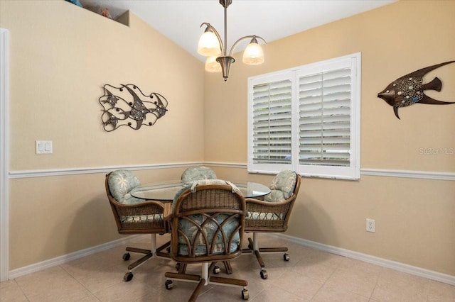 dining room with light tile patterned floors and a notable chandelier