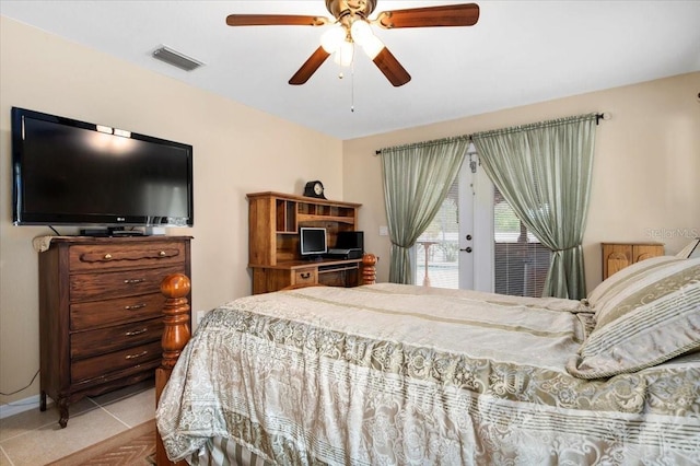 tiled bedroom with ceiling fan and access to outside