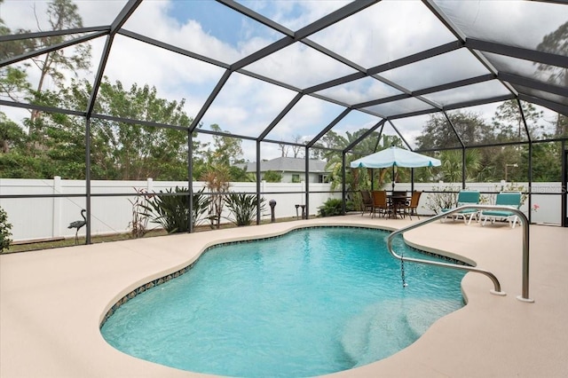 view of pool with a lanai and a patio area