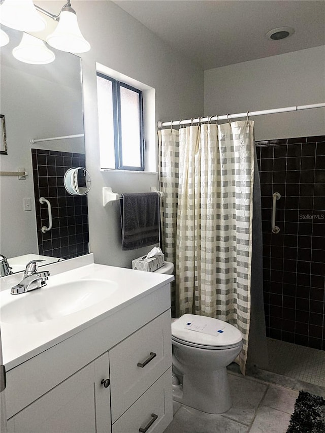 bathroom featuring vanity, toilet, and a shower with curtain