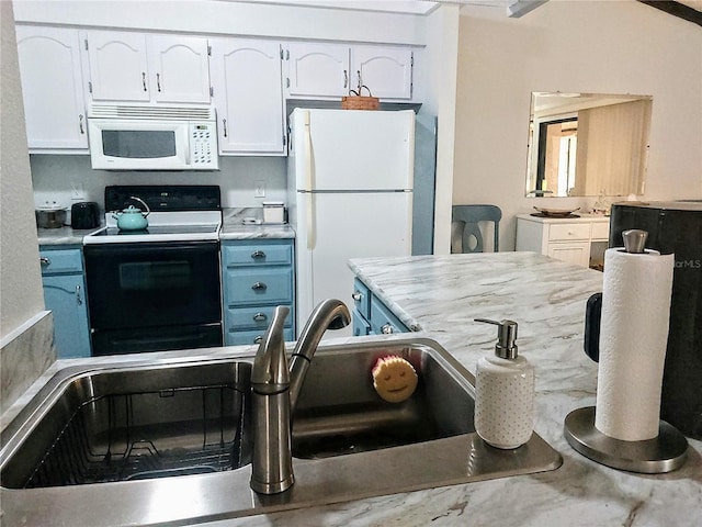 kitchen with white cabinetry, sink, and white appliances