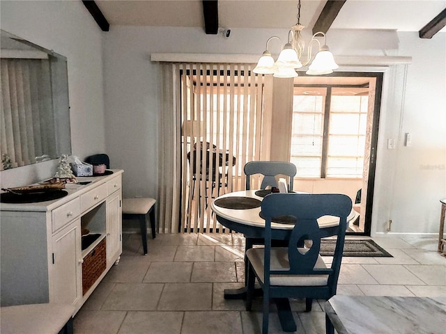 dining room with an inviting chandelier, tile patterned floors, and beamed ceiling