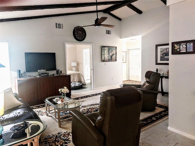 living room with lofted ceiling with beams, light tile patterned floors, and ceiling fan