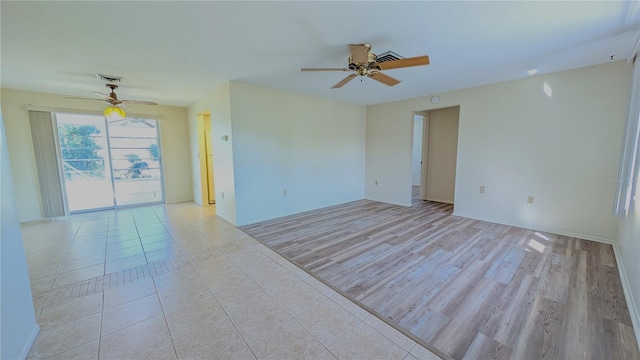 spare room with light hardwood / wood-style floors and ceiling fan