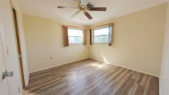 spare room featuring ceiling fan and wood-type flooring