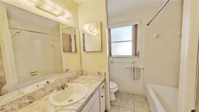 full bathroom with vanity, tiled shower / bath, tile patterned floors, and toilet