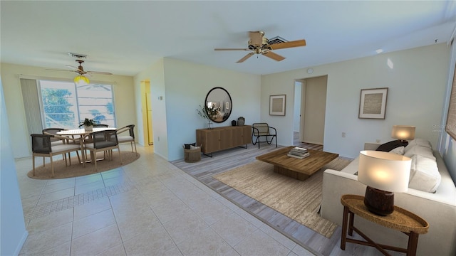 tiled living room with ceiling fan