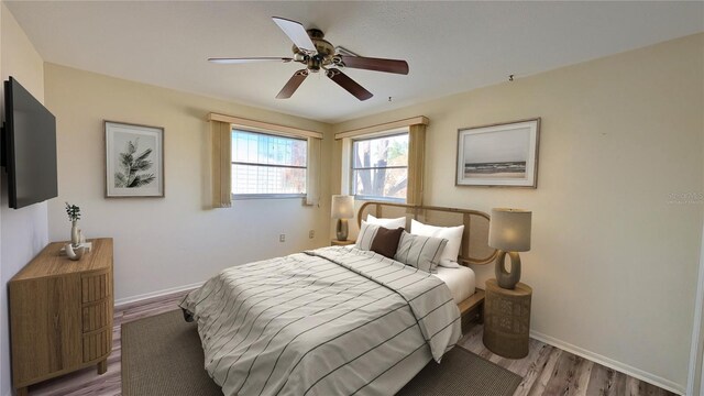 bedroom featuring light hardwood / wood-style flooring and ceiling fan