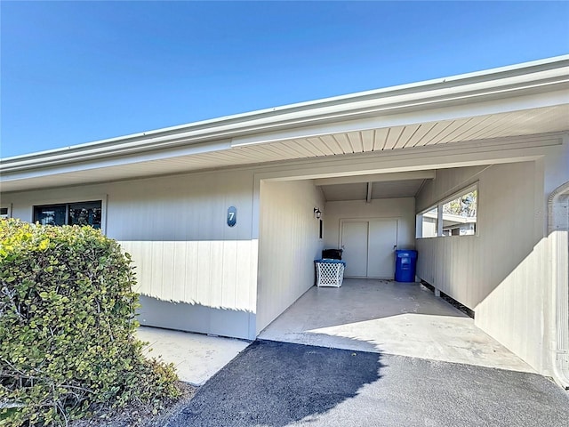 entrance to property featuring a carport