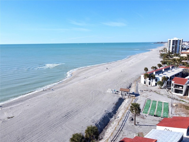 birds eye view of property featuring a view of the beach and a water view