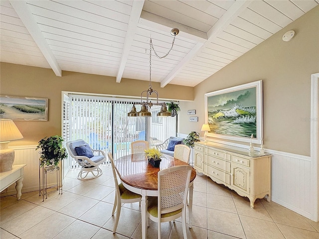 tiled dining room with wood ceiling and lofted ceiling with beams