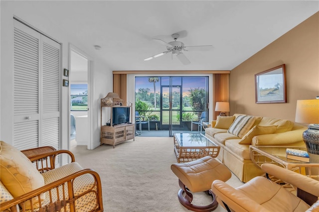 living room with ceiling fan and light carpet