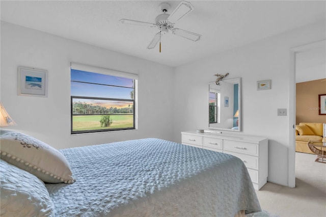 bedroom featuring ceiling fan and light colored carpet