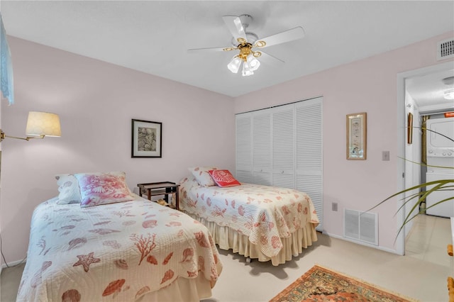 bedroom featuring light carpet, a closet, and ceiling fan