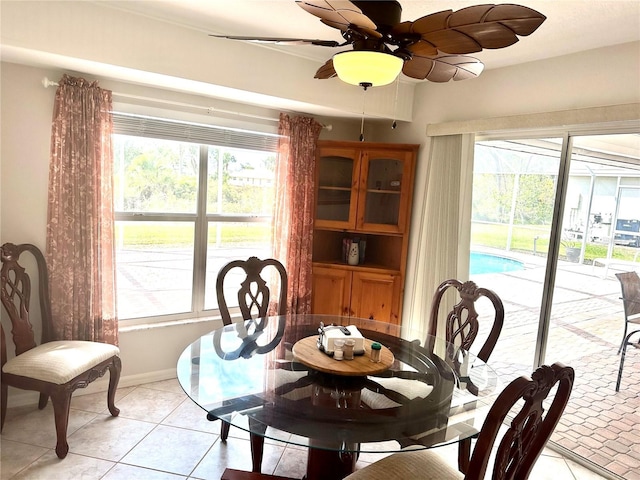 tiled dining room with ceiling fan