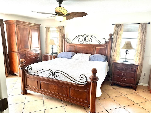 bedroom featuring light tile patterned flooring and ceiling fan