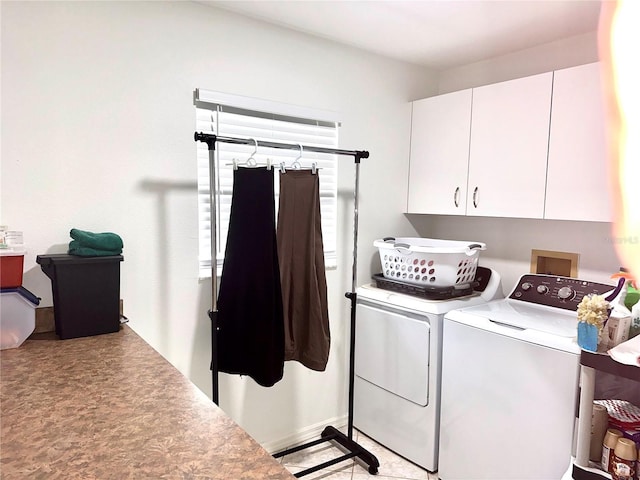 laundry room with cabinets and washing machine and dryer