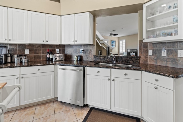 kitchen featuring ceiling fan, a sink, white cabinets, backsplash, and dishwasher