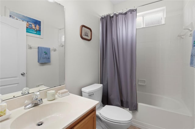 bathroom with shower / bath combination with curtain, vanity, and toilet