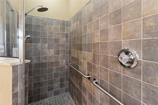 full bathroom with tiled shower