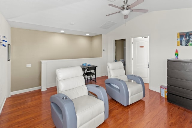 sitting room with lofted ceiling, ceiling fan, baseboards, and wood finished floors