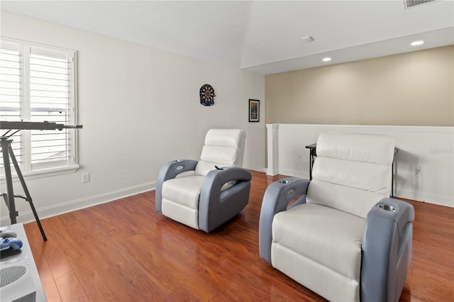 sitting room with recessed lighting, wood finished floors, visible vents, and baseboards