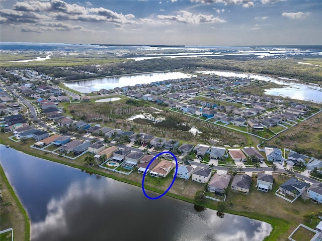 aerial view featuring a water view and a residential view