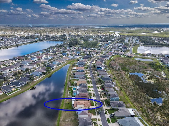 aerial view featuring a residential view and a water view