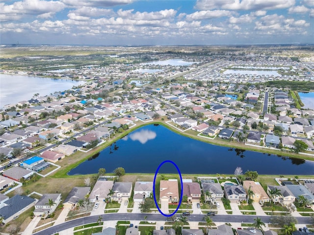 aerial view featuring a residential view and a water view