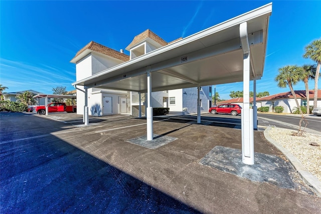 view of parking with a carport