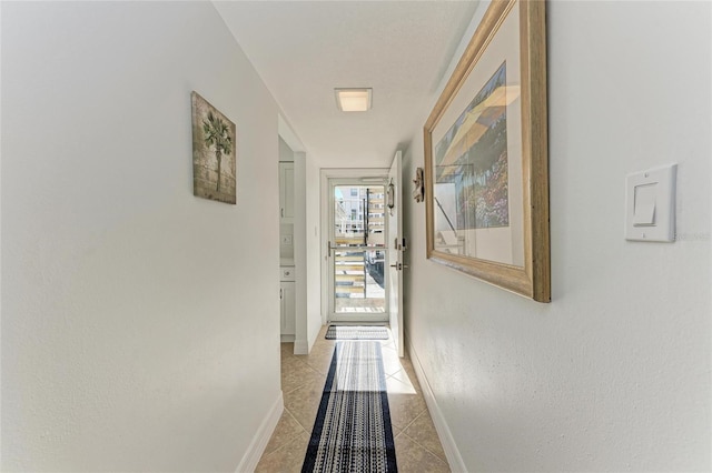 corridor with light tile patterned floors