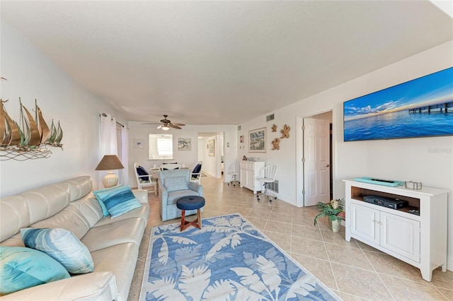 tiled living room with ceiling fan