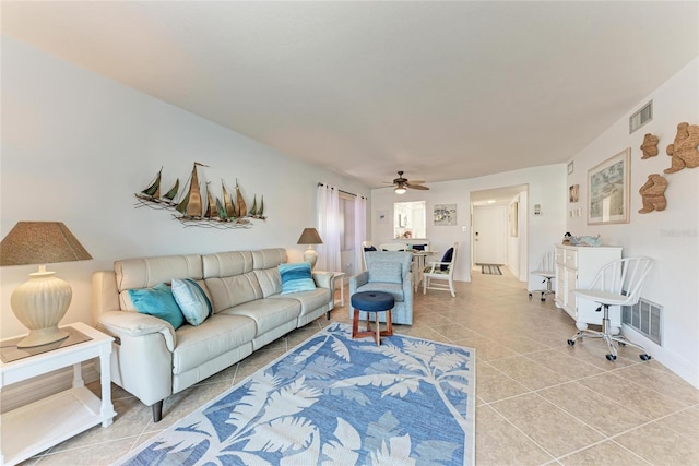 living room with light tile patterned flooring and ceiling fan